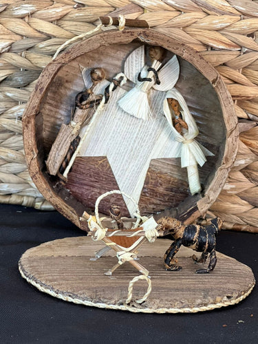 The Handmade Miniature Nativity Set by Her Best Foot Forward is a fair wage Christmas decor from Tanzania, beautifully crafted from corn husks and featuring Mary, Joseph, baby Jesus, and more—showcasing exquisite African artistry.