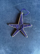Load image into Gallery viewer, The Reach for the Stars ornament by Her Best Foot Forward, handcrafted by women artisans in East Africa, features dark blue beads and wire with a loop for hanging—a unique, purpose-driven donation gift with card.