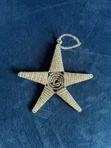 The Reach for the Stars - Tax-Deductible Honor Gift Donation with Card by Her Best Foot Forward features a beaded star ornament, handmade by East African women artisans—an ideal gift supporting girls’ education.